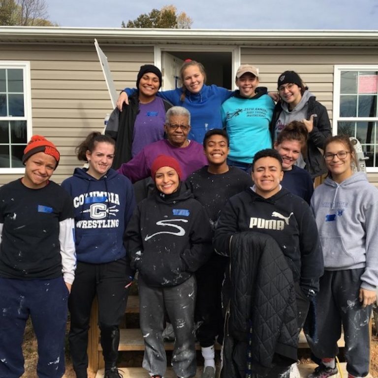 this photo shows the members of the women's wrestling team working on a Ferrum College service project for Habitat for Humanity