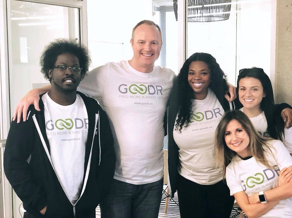 this photo depicts Jasmine Crowe and her Goodr team that works to feed the hungry and reduce food waste