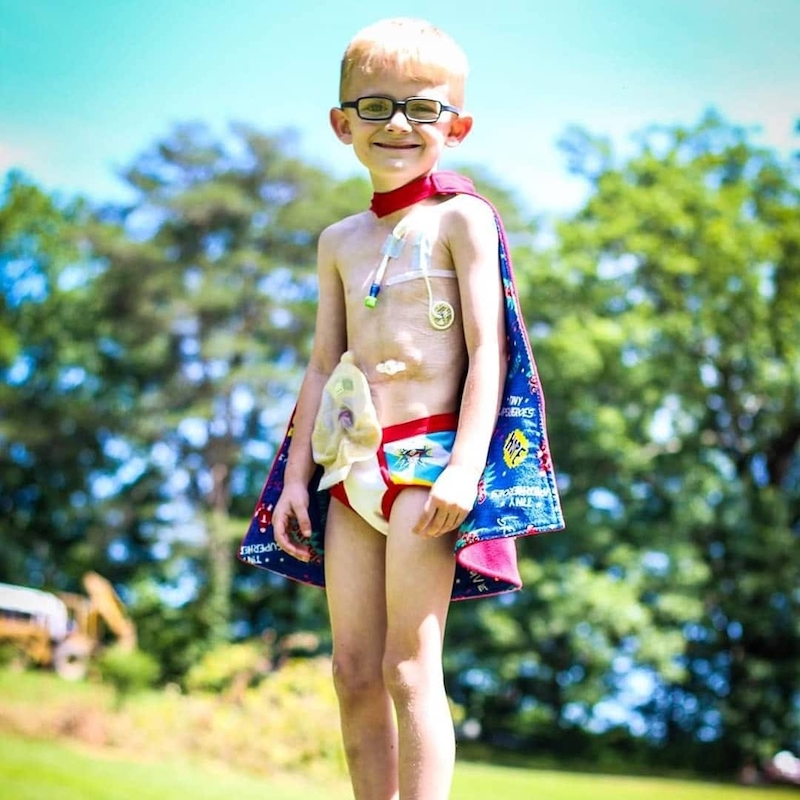 this photo shows Gunner Bowlin, the inspiration for Gutsy Gunner's Sweet Dreams, in a superhero costume.