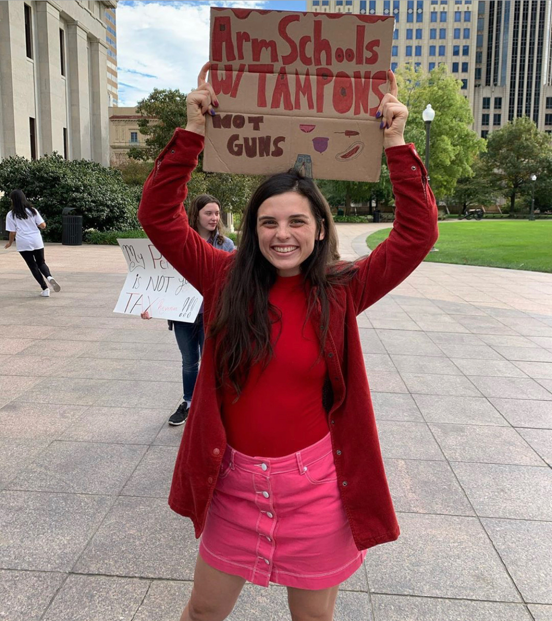 a photo of a period tax protester at Ohio State University