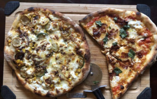 this photo shows two pizzas made by Stephen Turselli, founder of the Social Justice Pizza Project in Pittsburgh