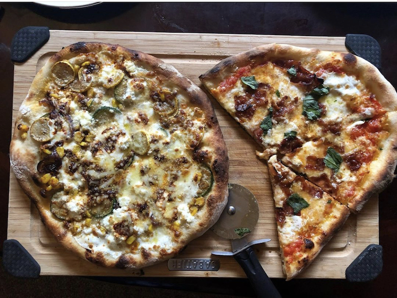 this photo shows two pizzas made by Stephen Turselli, founder of the Social Justice Pizza Project in Pittsburgh