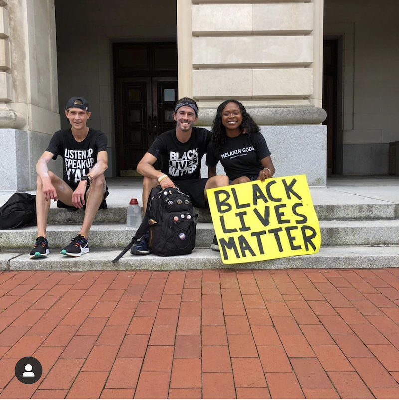 this photo shows Josh Nadzam with a Black Lives Matter sign prior to the Run for Black Lives fundraiser