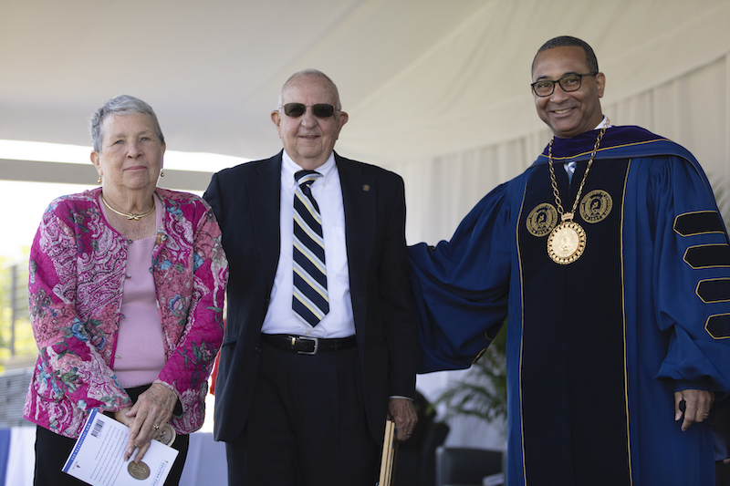 this photo shows Judy and Paul Leonard receiving the Algernon Sydney Sullivan Award at Queens University of Charlotte