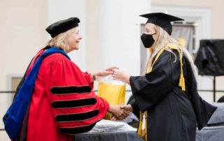 this photo shows Mary Baldwin University president Pamela Fox presenting the Algernon Sydney Sullivan Award to Kylie Stottlemyer