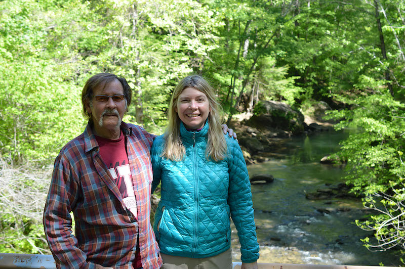 this photo depicts Leigh Mayberry, an Alabama nurse, on a hike with her father, Rick, in the Sipsey Wilderness