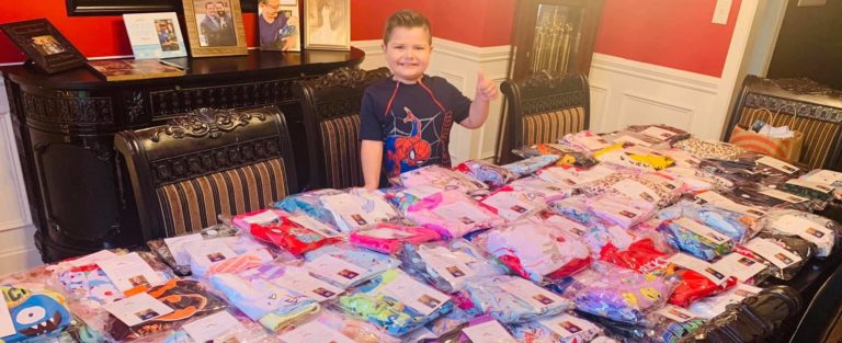 this photo shows Noah Sileno with medically adapted pajamas donated by the #NoahNation Foundation to kids with cancer