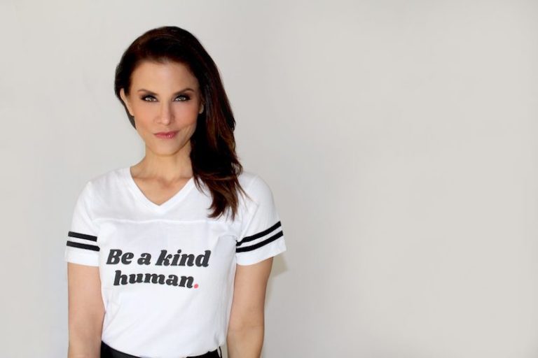 this photo shows news anchor Lu Parker wearing a t-shirt from her company, Be Kind & Co.