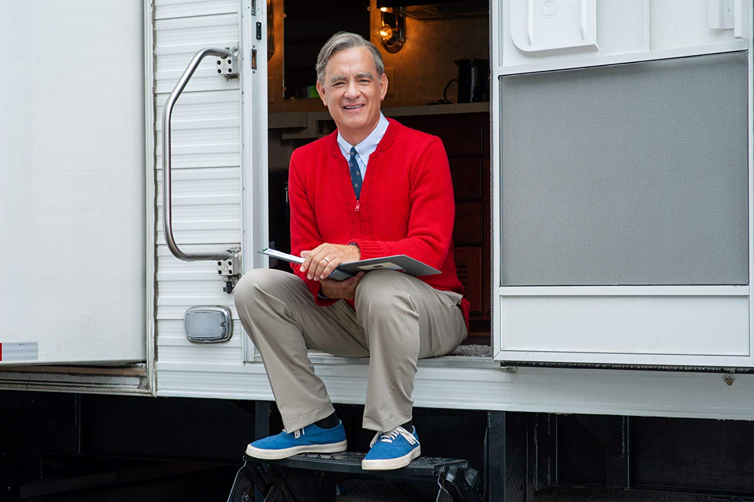 this photo shows Tom Hanks in the role of the real Mister Rogers