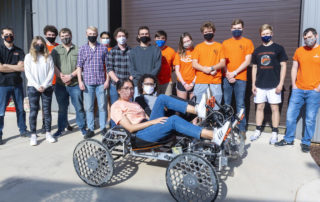 this photo shows Campbell University students in a rover they designed for space missions for a NASA competition.