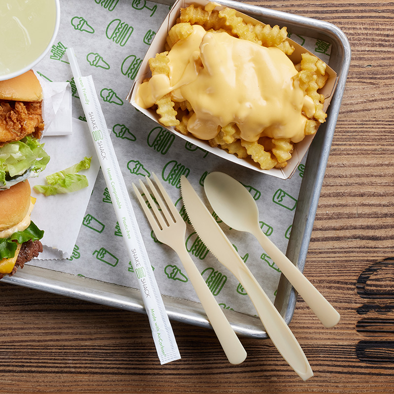 this photo shows biodegradable, sustainable straws and eating utensils being tested at Shake Shack