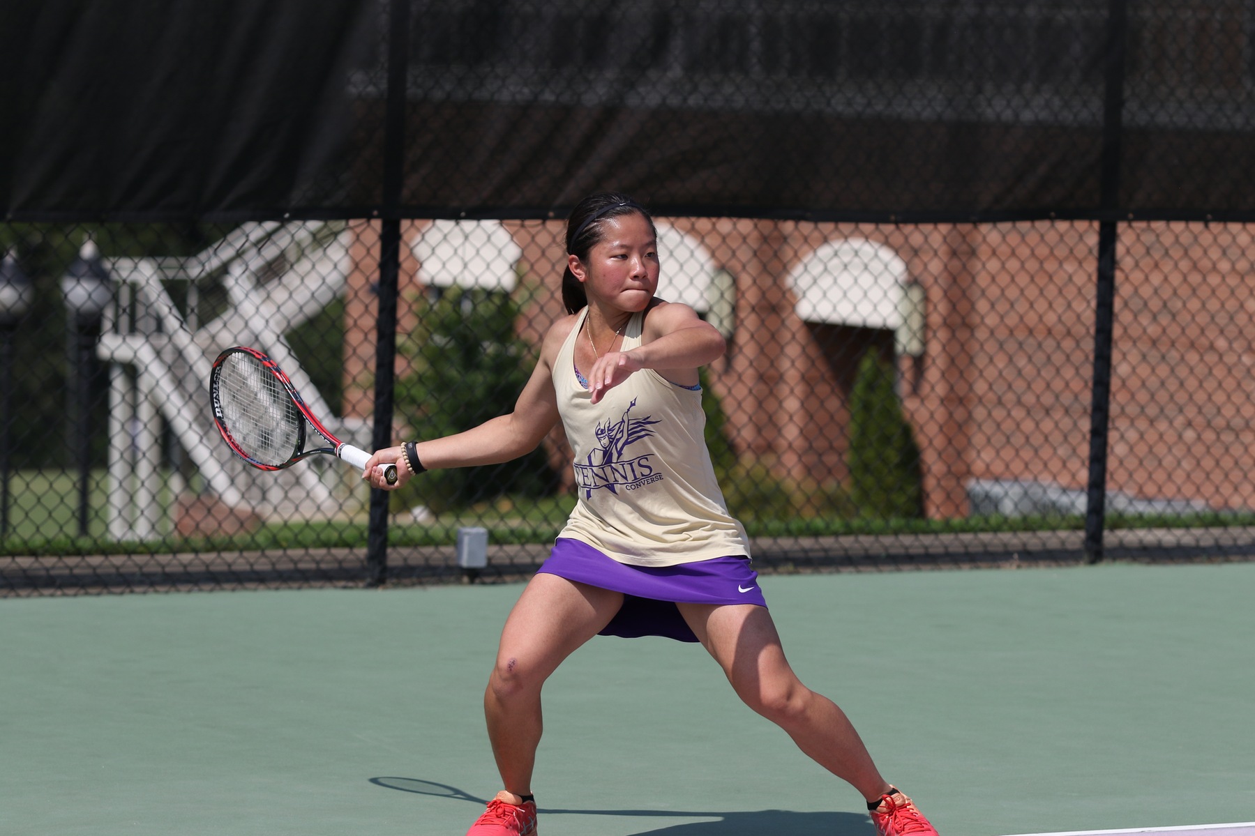 photo of Steffi Kong of Converse College playing tennis