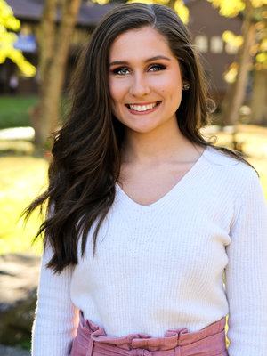 this photo depicts a graduate of Alice Lloyd College, a prominent tuition-free college in Kentucky