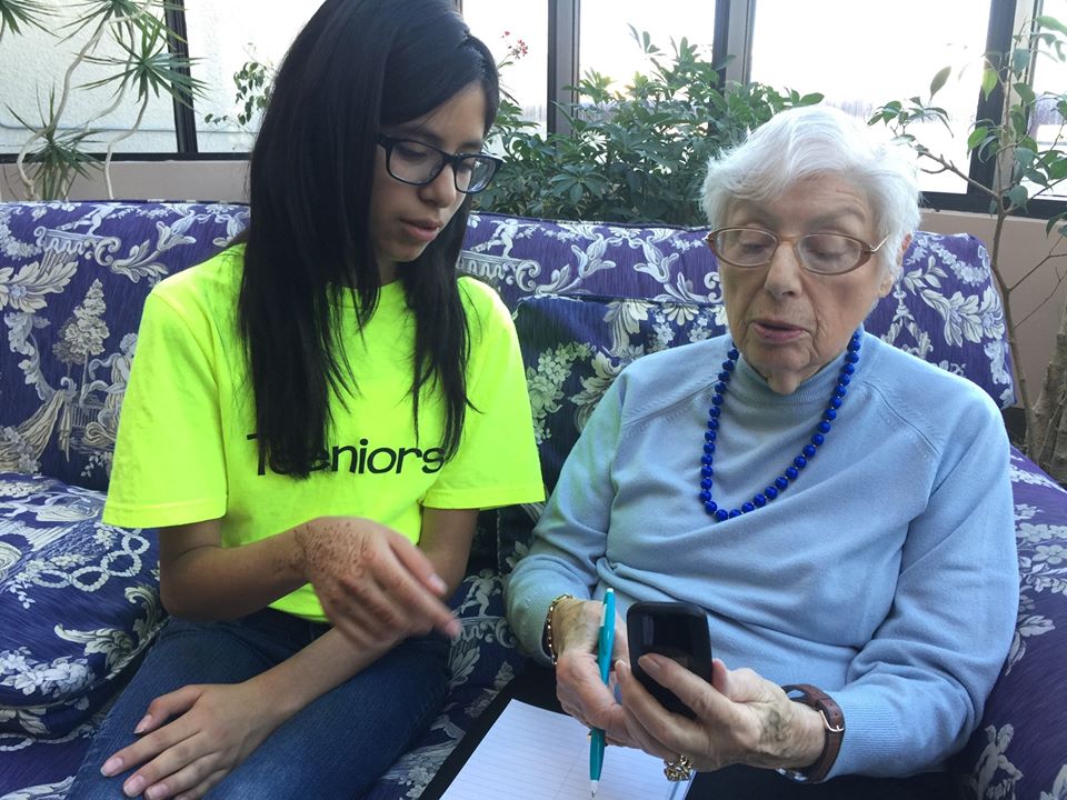 this photo shows a Teeniors teen with an elderly client