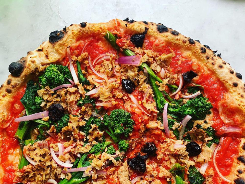 this is a photo of a vegetarian pizza made with seitan-based sausage crumbles available through VEDGEco, a national wholesaler of plant-based foods for the restaurant industry