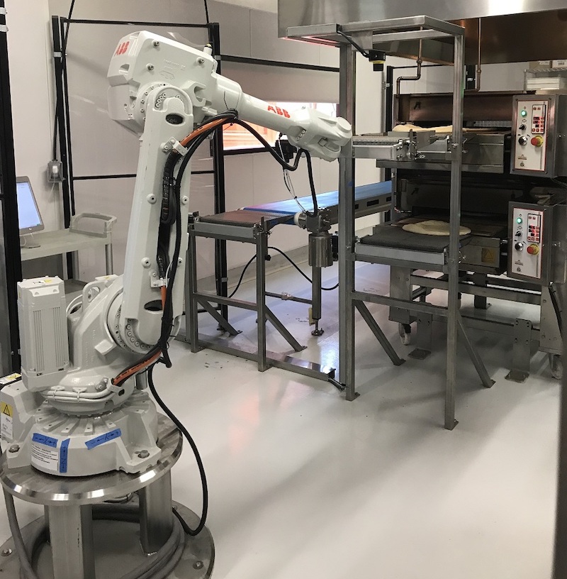 this photo shows a robot created by Zume that's now used to develop sustainable packaging