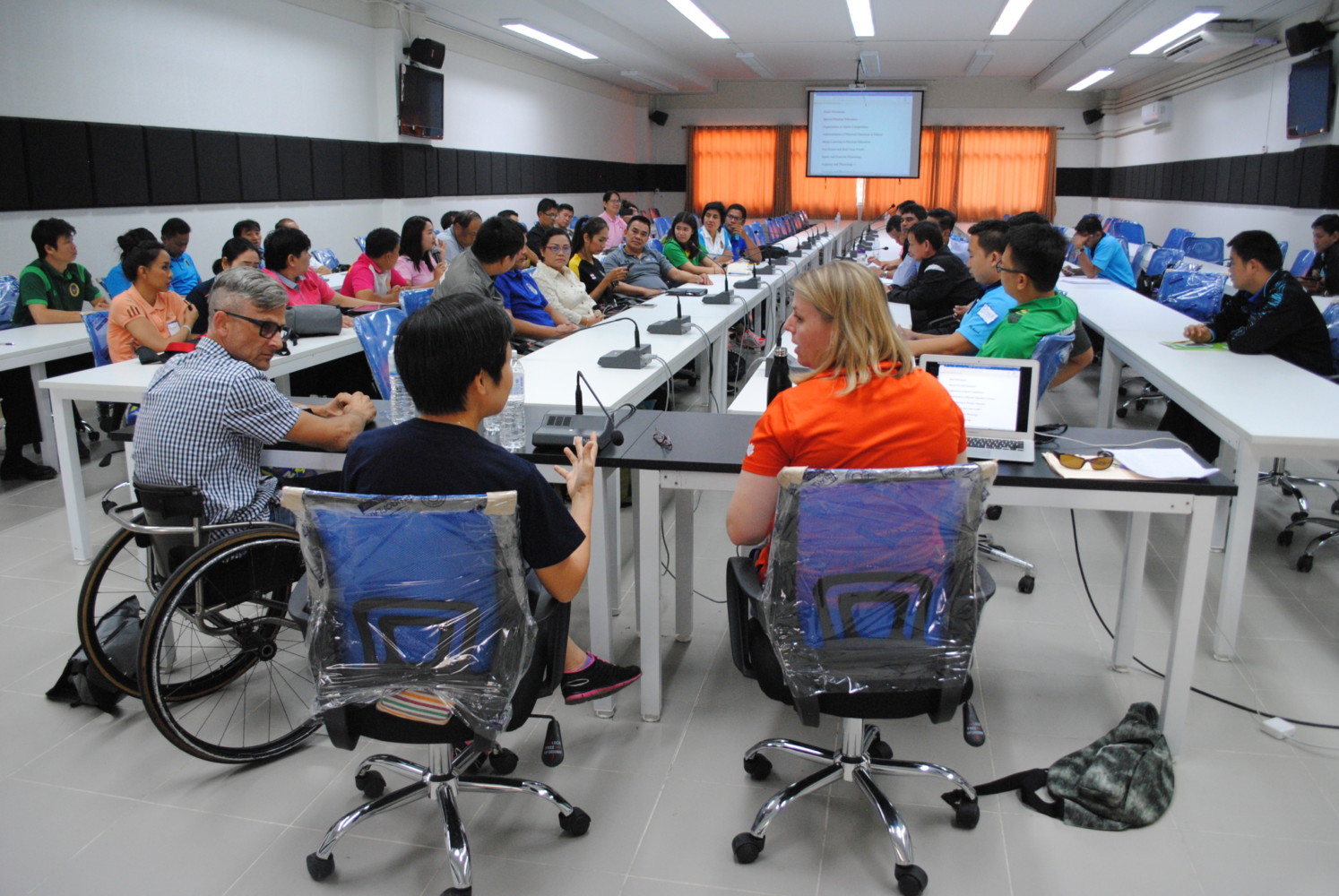 this photo shows Jasmine Townsend of Clemson University addressing members of the Thai Paralympics Committee on inclusion in recreation