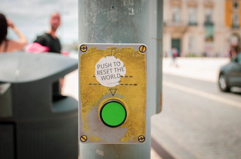 this photo of a green button illustrates the concept of the Great Reset of the world economy