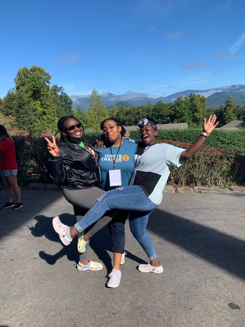 this shows a group of three students celebrating their new skills at the Sullivan Foundation's Fall 2021 Ignite Retreat event for college changemakers