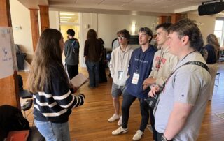 Participants discuss a project idea at the Spring 2026 Ignite Retreat.
